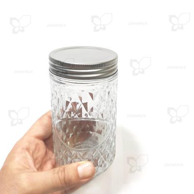 جار شیشه ای درب کانتینری استوانه ای قطر 7 ارتفاع 13 طرحدار مدل ماربلا نیم کیلو عسل